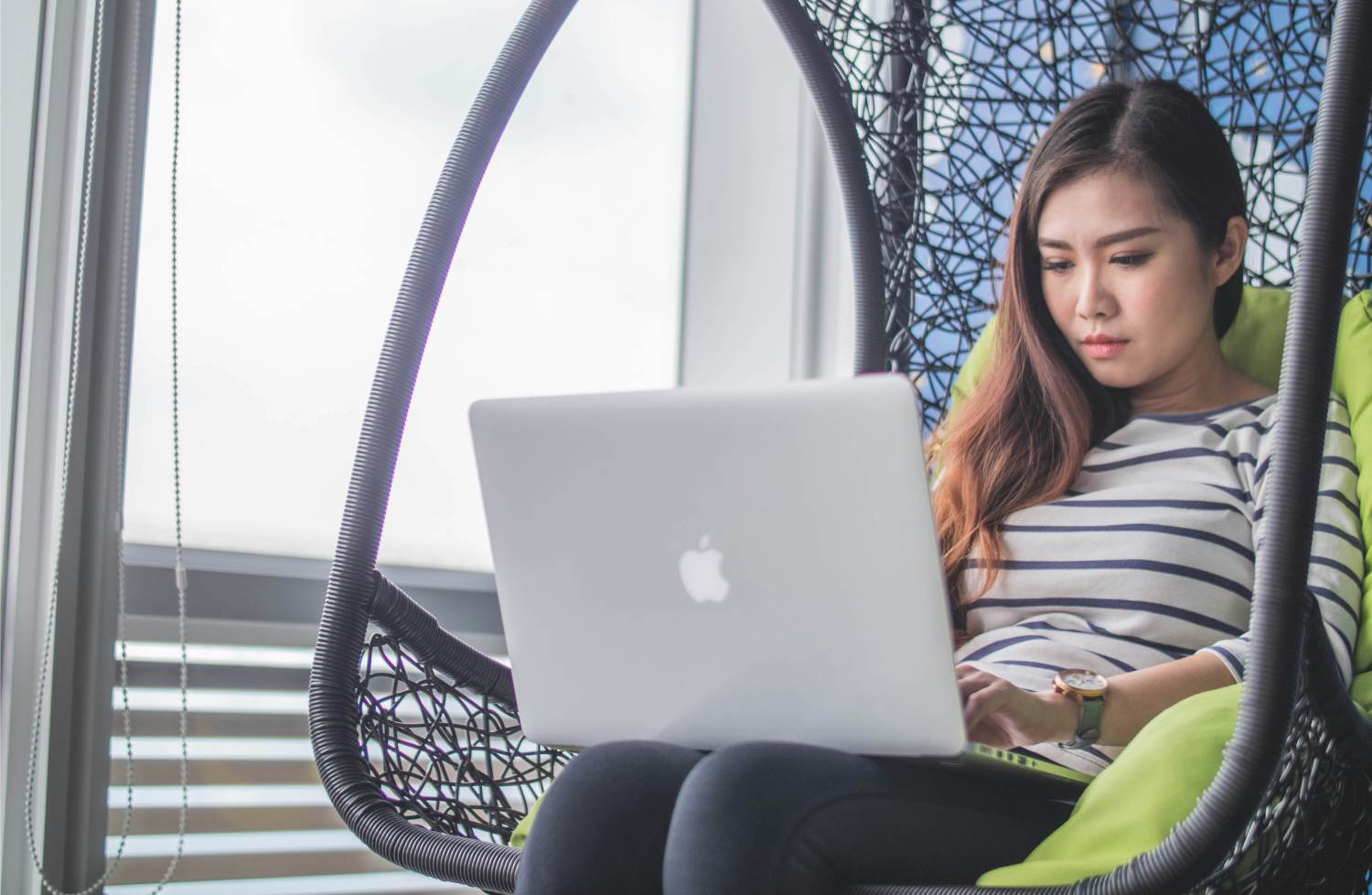 macbook on womans lap