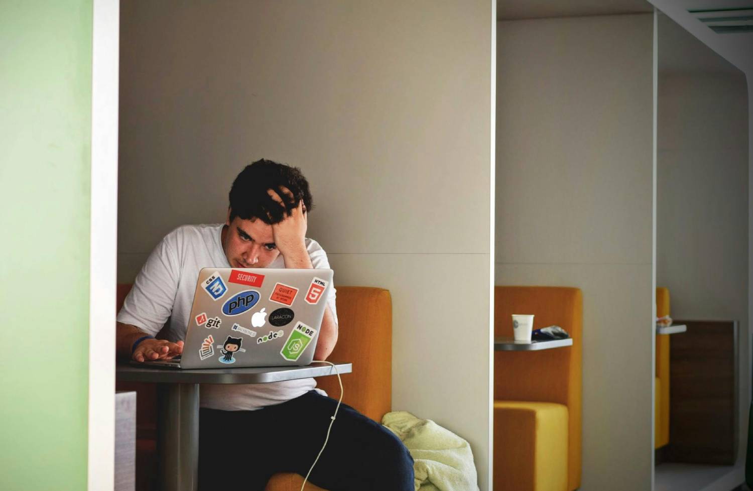 man-in-white-shirt-using-macbook-pro